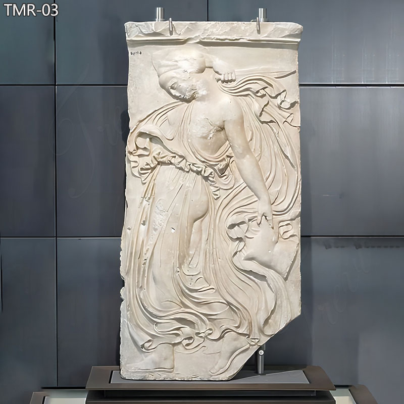 hand carved marble relief with a dancing maenad