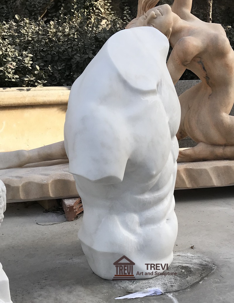 white marble torso sculpture