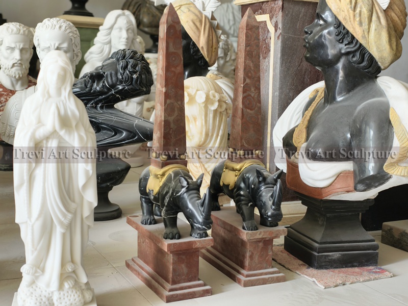 marble stone obelisk with animal